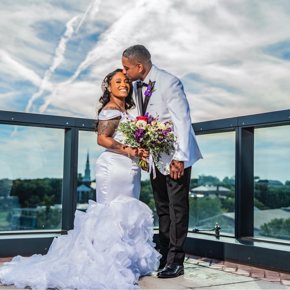 No brand. White wedding dress. Dress was tailored. I’m 4’9.